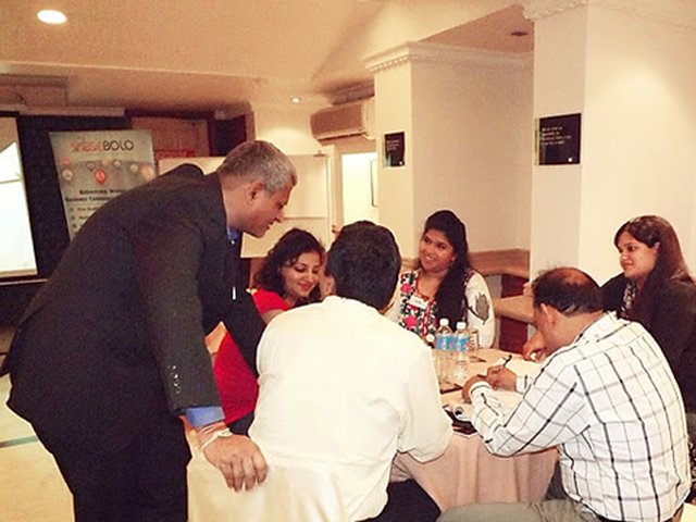 Suneel Agarwal coaching a small group