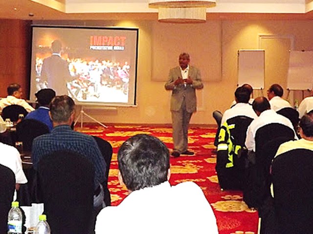 Suneel Agarwal presenting to a conference room